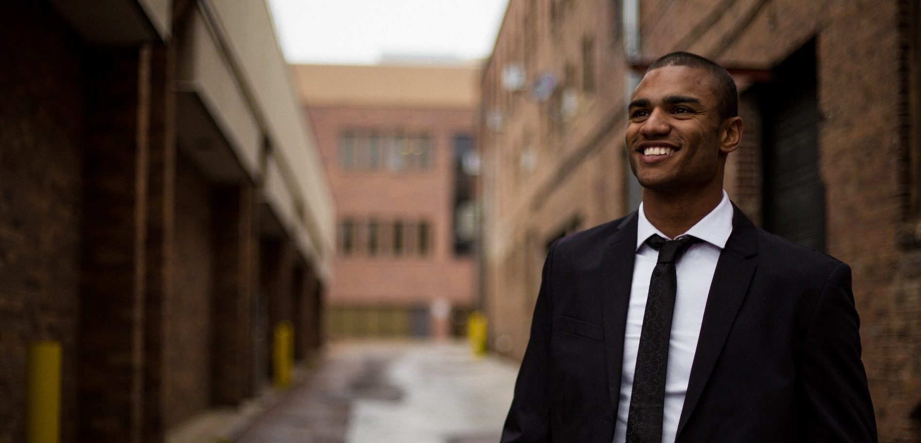 Man in a suit looking happy